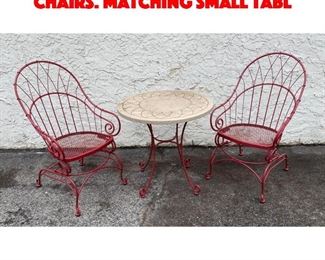 Lot 239 Red Metal Spring Seat Patio Chairs. Matching small tabl