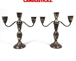 Lot 548 Pair Sterling Weighted Candlesticks. 