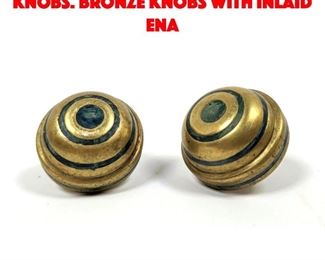 Lot 559 Two Stamped Mendoza knobs. Bronze knobs with inlaid ena