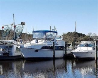 1988 Carver 360 Mariner Flybridge-40' boat, If you are looking for a condo on the water here it is. And sells with 6 months free slip rental, 2 7.4 Mercruiser engines, new interior, new top new full enclosure, full salon with dinette, sofa, kitchen, wet bar, twin bunks, full bath, queen size master, new kohler generator