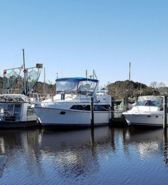 1988 Carver 360 Mariner Flybridge-40' boat, If you are looking for a condo on the water here it is. And sells with 6 months free slip rental, 2 7.4 Mercruiser engines, new interior, new top new full enclosure, full salon with dinette, sofa, kitchen, wet bar, twin bunks, full bath, queen size master, new kohler generator
