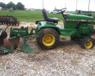 John Deere 314 with 5 implements