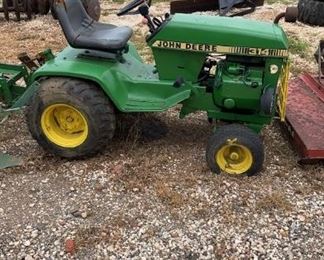 John Deere 314 with 5 implements