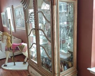 Great display cabinet. How about the decorative carousel horse!