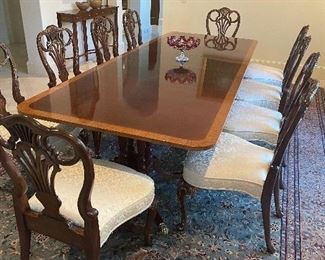 Table with 8 chairs.  retailed 15,000.  Opening bid 1000