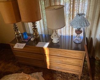 Mirrored dresser.  Lamps