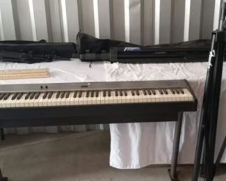 Roland FP2 Digital Piano with Stand, Microphone and Stand, Drum Sticks, Etc