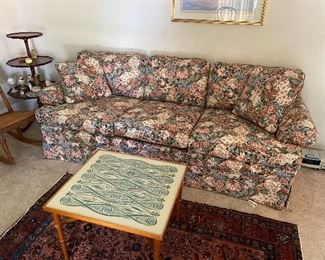 Floral couch and Persian rug