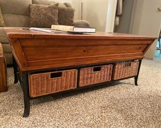 Nice coffee table with center top storage & basket drawers. 