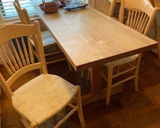 Very nice sturdy & slim dining table with matching chairs. Nice tightly woven seats 