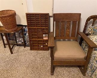 Antique rocker, printers tray, wicker trashcan  and small side table. 