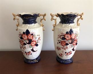 Pair of pottery vaces with floral accents C. 1890