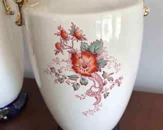 Pair of pottery vaces with floral accents C. 1890
