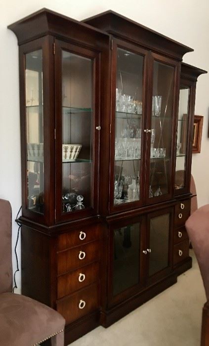 Beau Nouveau Breakfront Cabinet with silver tone pulls. A more contemporary look with all around glass on top and glass on bottom. Eight drawers for storage. Also, a matching dining table.