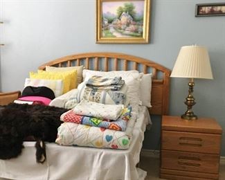 Oak headboard, nightstand. Bedding