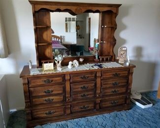 Dresser with mirror, part of bedroom set.