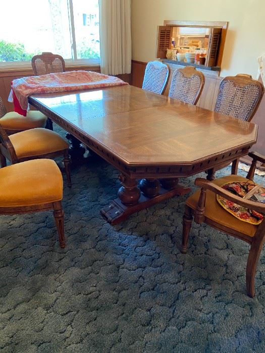 BEAUTIFUL  50+ year old dining room table in pristine condition with additional leaf that will allow ample seating for 10 adults.  Do not miss this one!!!  Chairs are in excellent condition.  All crystal photos are taken on the table top.  