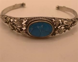 Silver and Turquoise Cuff is 1/2" thick at widest point and measures2 1/2" by 2". the stone measures 3/8' by 5/8" $45