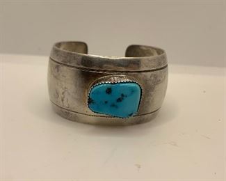Chunky Cuff  1 3/8" thick and measures 17/8" by 21/4" and the turquoise measures 3/4" by 1/2". $95 stamped with a makers mark and sterling