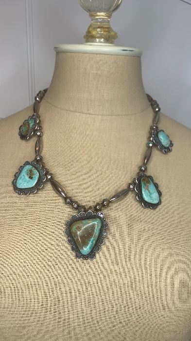 Statement Piece 22" long silver beaded necklace with 5 large greenish turquoise pendants with the largest being 1.5" by 1.75"  and the smallest being 1" by 1 1/8". $500
