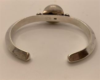 Back-23/8” by 13/4” Cuff with black stone -quite heavy $40