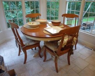 Kitchen table has 2 extra leaves plus 4 chairs.
