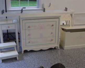 White wood bedroom set, twin canopy bed, dresser, night stand, toy chest, and stairs.