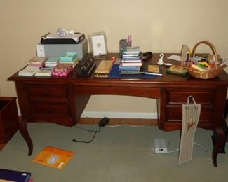 $1400 desk with lots of office stuff.