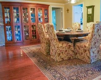 Dining room table and chairs, large area rug, and large cabinet