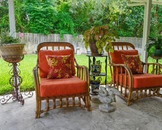 Bamboo chairs and wrought iron plant stands