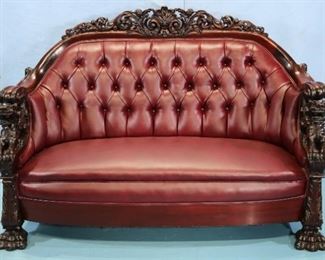 123a - Karpen solid mahogany sofa with carved back and arms with dragon heads, heavy like new burgundy vinyl and claw feet, 44 in. T, 65 in. W, 23 in. D.