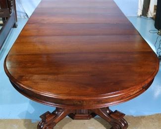054d - Walnut Victorian banquet table with burl trim , carved base and 7 large 18.5 in. leaves, total length, 31 in. T, 15 ft., 10 in. L, 60 in. W.