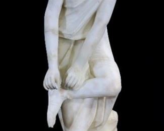 056a - Marble statue of classical maiden standing on rock work, 33 in. T, 14 in. W.