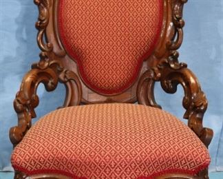 043a - Solid mahogany rococo ladies hip rest parlor chair with carvings on crown and arms, attrib. to Charles Boudoine, 43 in. T, 26 in. W, 22 in. D.
