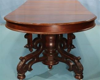 083 - Walnut Victorian banquet dining table with 5 skirted leaves and beautifully carved base, all original, makes a 11 ft. 5 in. Table, 47 in. W, ca. 1870