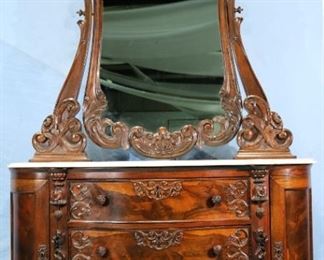 086a - Rosewood heavily carved marble top dresser, premium grade attrib. to Mitchell and Rammelsberg, 88.5 in. T, 56 in. W, 23 in. D.