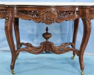 090a - Rosewood rococo pierced carved parlor table with white marble turtle top, attrib. to Meeks, 31 in. T, 50 in. W, 30 in. D.