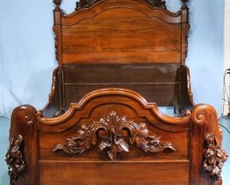 091a - Rosewood rococo full size bed with heavy carvings on footboard and beautifully carved crest on headboard, attrib. to A, Roux