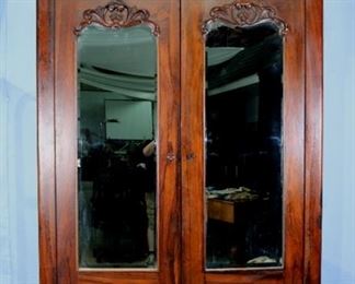 097a - Rosewood empire 2 door complete wardrobe with mirror doors and carved crown, 70 in. W, 28 in. D.