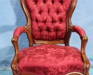 114Aa - Carved arm parlor chair with carved grapes in crown, 43 in. T, 26 in. W, 22 in. D.