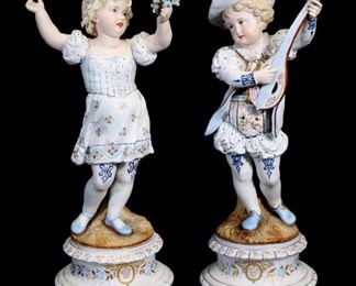 312a - Pair of hand painted biscuit figurines, 21 in. T, 8 in. Dia.