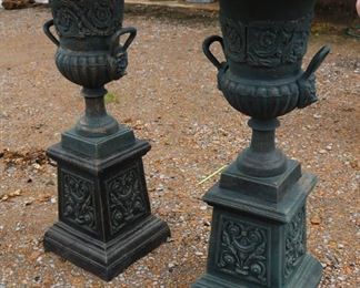 380a - Matched pair of double handle cast iron urns with lion heads, green with gold accents, 41 in. T, 18 in. R.