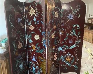 Wood room divider.  Different designs on each side