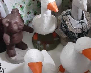 Cement geese and bears.