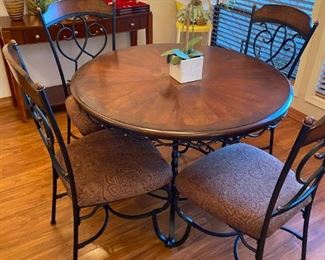 Beautiful round bistro dining set with four chairs