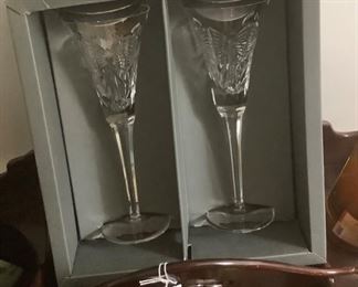 Two Waterford crystal champagne glasses with beautiful design.