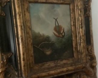 One of the beautifully framed oil paintings of the hummingbirds.