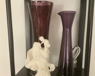 Two beautiful purple vases.  A beautiful white figure of a mother with her baby.
