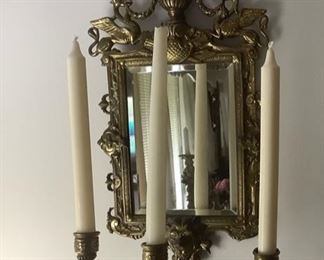 Close-Up of one of the solid brass sconces with beveled glass.