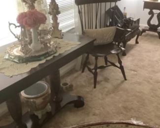Showing the mahogany Confederate table with tall candle sticks, silver tray and pink flowers in milk glass vase.